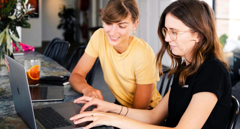 women reading bitcoin crypto newsletter watching bitcoin ethereum crypto news and trading tips price analysis on tablet